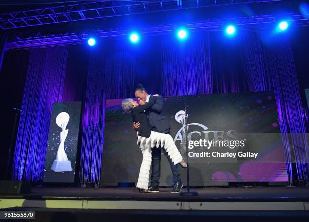 Frederic Yonnet performs onstage, joined by Lifetime Achievement Award Honoree Rita Moreno, at the 43rd Annual Gracie Awards at the Beverly Wilshire...