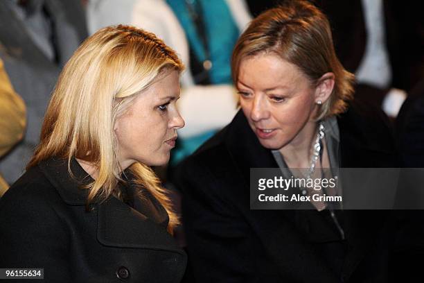 Corinna Schumacher , wife of seven-time world Formula One world champion Michael Schumacher, chats with Schumacher's press officer Sabine Kehm during...