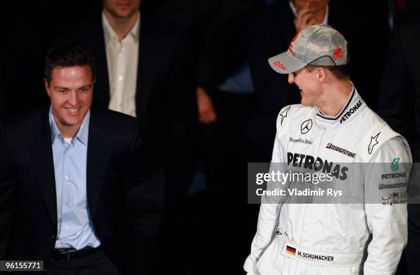 Mercedes GP Petronas Michael Schumacher speaks with his brother and former Formula One driver Ralf Schumacher during the Mercedes GP Petronas Formula...