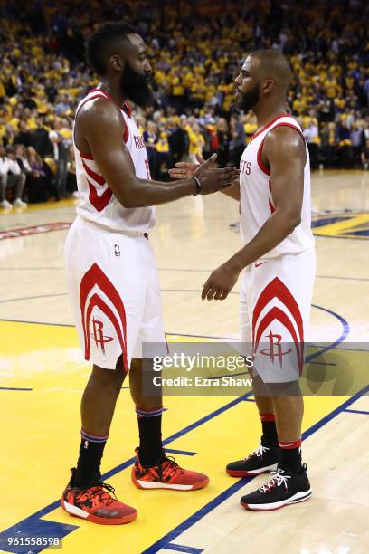 James Harden and Chris Paul of the Houston Rockets stand on the court as the officials review a play at the end of Game Four of the Western...