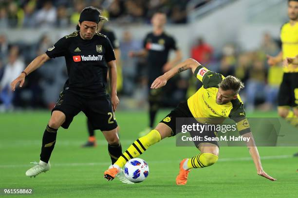 Lee Nguyen of Los Angeles FC defends against Andriy Yarmolenko of Borussia Dortmund during the second half of an International friendly soccer match...