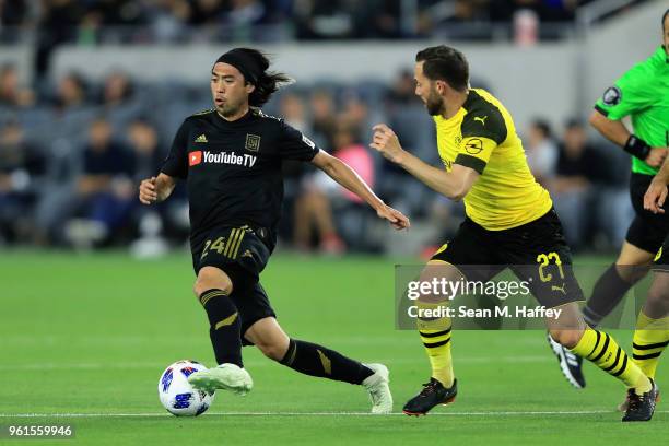 Lee Nguyen of Los Angeles FC dribbles past Gonzalo Castro of Borussia Dortmund during the second half of an International friendly soccer match at...