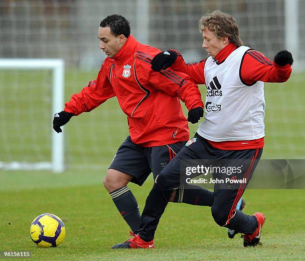 Lucas Leiva moves in on Nabil El Zhar during a Liverpool team training session at Melwood training ground on January 25, 2010 in Liverpool, England.