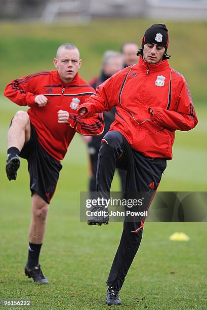 Alberto Aquilani and Jay Spearing warm up during a Liverpool team training session at Melwood training ground on January 25, 2010 in Liverpool,...