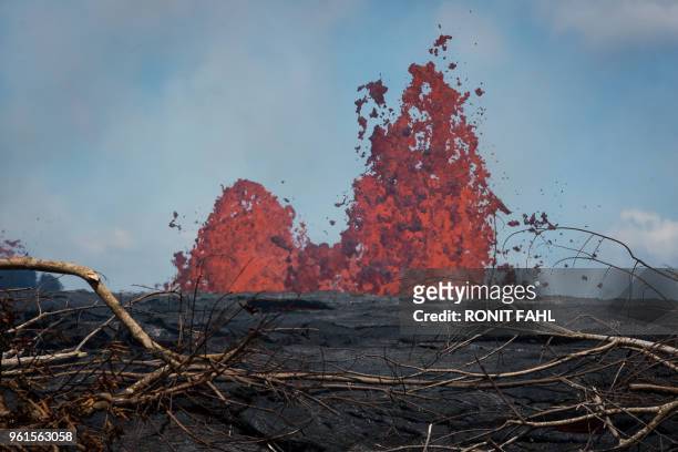 Fissure of the Kilauea volcano is seen on May 22, 2018 in the Leilani Estates subdivision of Pahoa, Hawaii. - Authorities in Hawaii have warned of...