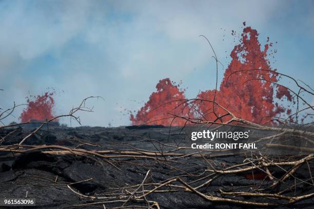 Fissure of the Kilauea volcano is seen on May 22, 2018 in the Leilani Estates subdivision of Pahoa, Hawaii. - Authorities in Hawaii have warned of...