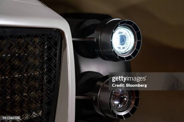 The front headlights are seen on Xing Mobility Inc.'s Miss R electric supercar on display in Hong Kong, China, on Wednesday, May 23, 2018. Xing...