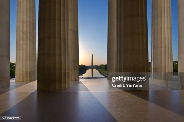 monumento a washington amanecer visto desde el monumento a lincoln en washington dc, estados unidos - edificio federal fotografías e imágenes de stock