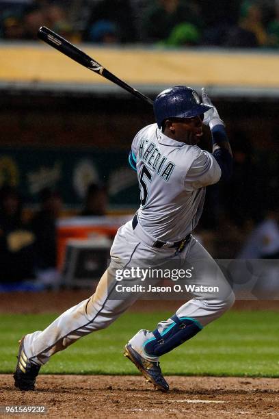 Guillermo Heredia of the Seattle Mariners hits an RBI double against the Oakland Athletics during the tenth inning at the Oakland Coliseum on May 22,...