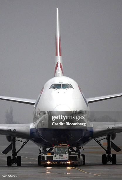 British Airways airplane moves along the tarmac at Terminal 5 at Heathrow airport in London, U.K., on Monday, Jan. 25, 2010. British Airways Plc will...