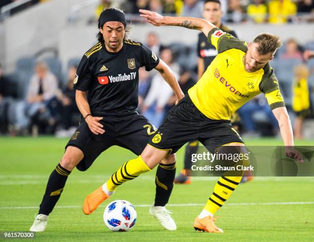 Lee Nguyen of Los Angeles FC battles Andriy Yarmolenko of Borussia Dortmund during Los Angeles FC's friendly match against Borussia Dortmund at the...