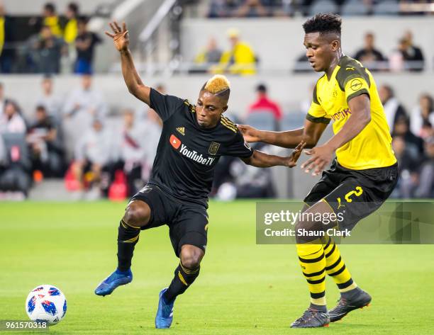 Latif Blessing of Los Angeles FC battles Dan-Axel Zagadou of Borussia Dortmund during Los Angeles FC's friendly match against Borussia Dortmund at...