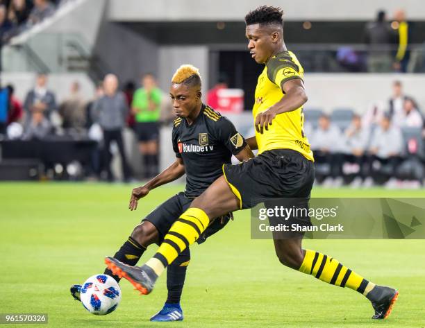 Latif Blessing of Los Angeles FC battles Dan-Axel Zagadou of Borussia Dortmund during Los Angeles FC's friendly match against Borussia Dortmund at...