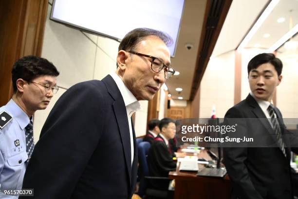 Former South Korean President Lee Myung-Bak appears for his first trial at the Seoul Central District Court on May 23, 2018 in Seoul, South Korea....