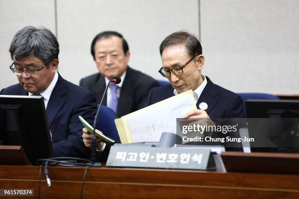 Former South Korean President Lee Myung-Bak appears for his first trial at the Seoul Central District Court on May 23, 2018 in Seoul, South Korea....