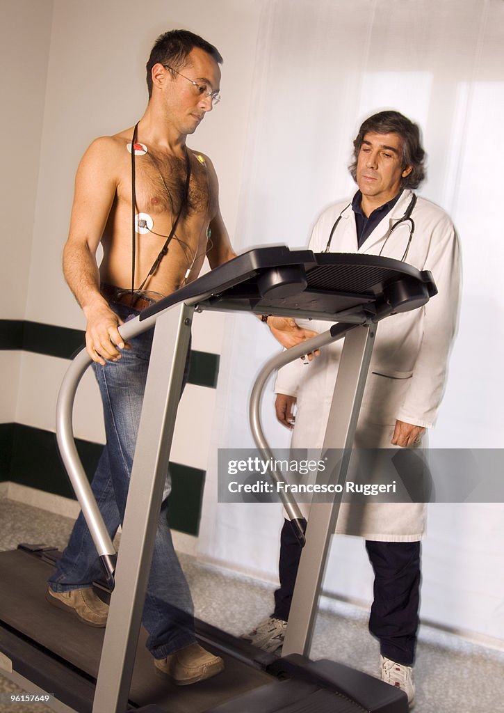 Patient undergoing stress test on treadmill