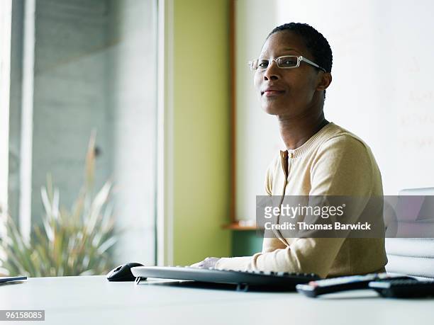Businesswoman sitting at conference room table