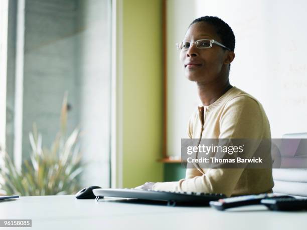 Businesswoman sitting at conference room table