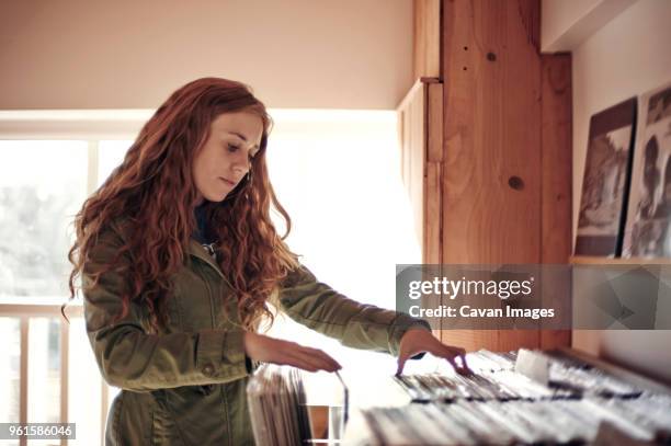 woman shopping at record store - record store stock pictures, royalty-free photos & images