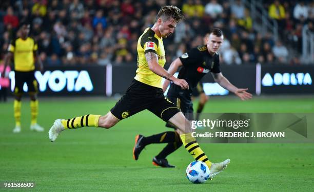 Maximilian Philipp of Borussia Dortmund looks to pass under pressure from James Murphy of LAFC during their international footbal friendly...