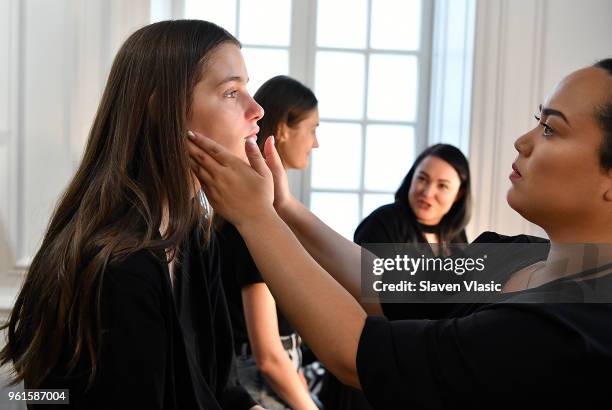 Models prepare backstage at Oscar De La Renta Resort 2019 Runway Show at Academy Mansion on May 22, 2018 in New York City.