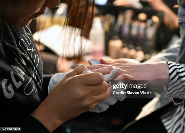 Models prepare backstage at Oscar De La Renta Resort 2019 Runway Show at Academy Mansion on May 22, 2018 in New York City.