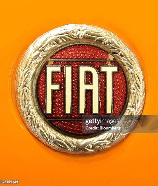 Fiat logo is seen on a Fiat Spider 124 automobile on display at the Retromobile auto exhibition in Paris, France, on Saturday, Jan. 23, 2010. The...