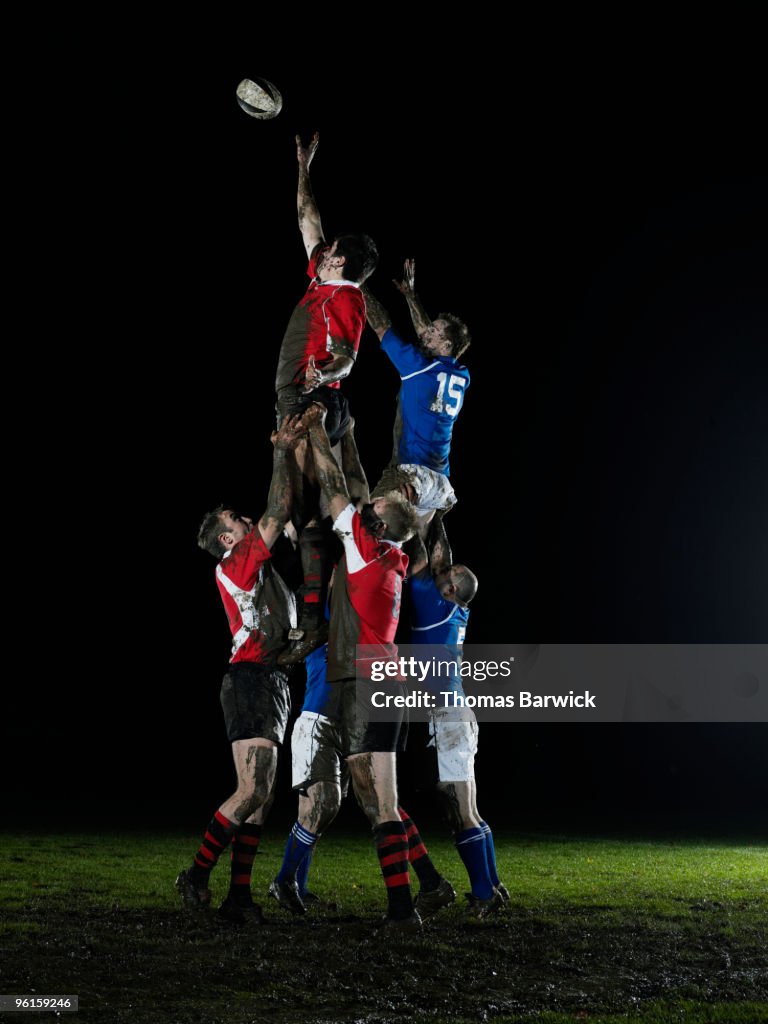 Two teams jumping for ball in rugby lineout