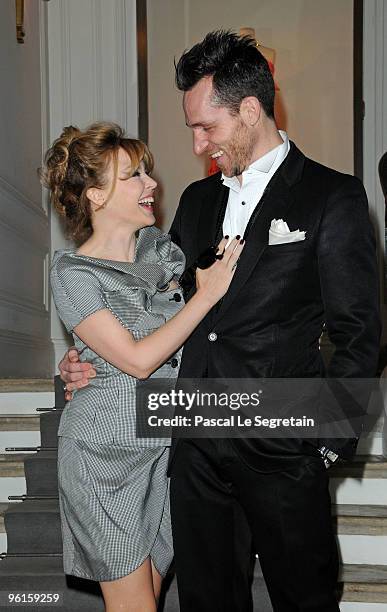 Kylie Minogue and unidentified guest attend the Christian Dior Haute-Couture show as part of the Paris Fashion Week Spring/Summer 2010 at Boutique...