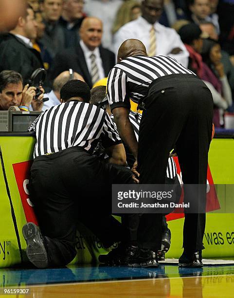 Referees watch an instant replay of a last-second, game-winning shot by Mike Stovall of the DePaul Blue Demons against the Marquette Golden Eagles at...