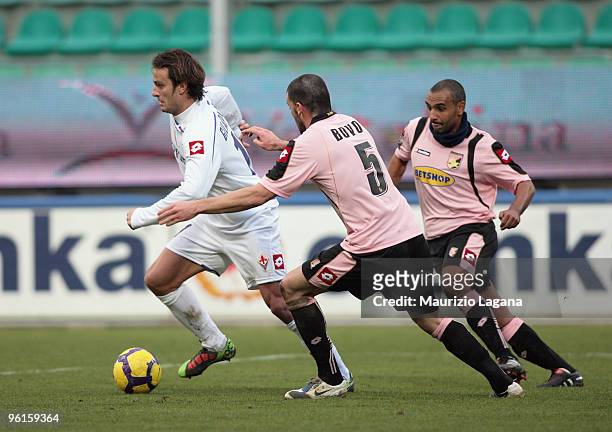 Alberto Gilardino of Fiorentina is challenged by Cesare Bovo and Fabio Liverani of Palermo during the Serie A match between Palermo and Fiorentina at...