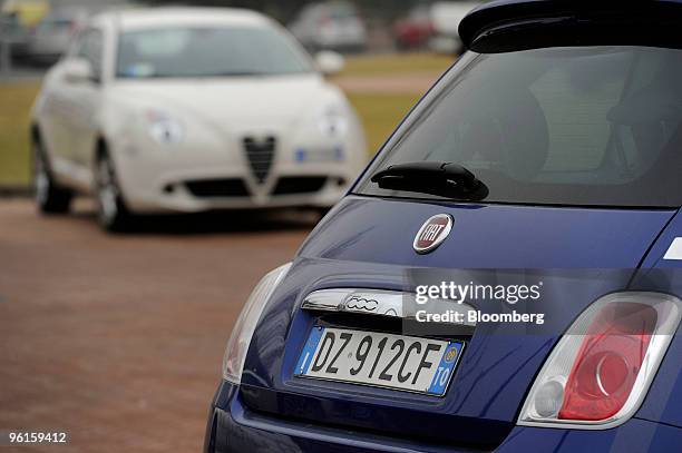 Fiat 500, right, and Alfa Romeo Mito automobiles are seen parked at the Mirafiori Motor Village in Turin, Italy on Friday, Jan. 22, 2010. Fiat SpA,...