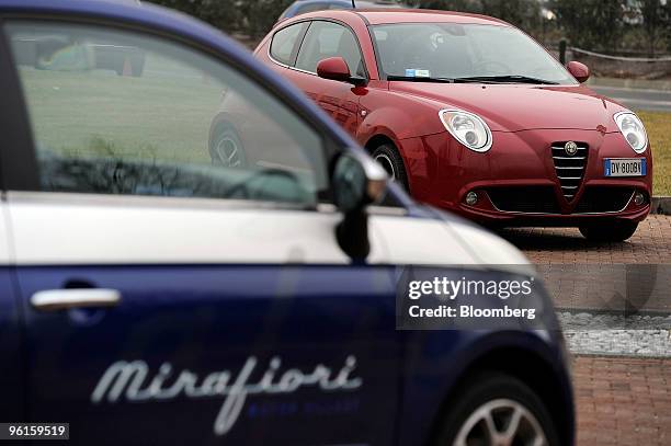 Fiat 500, left, and Alfa Romeo Mito automobiles are seen parked at the Mirafiori Motor Village in Turin, Italy on Friday, Jan. 22, 2010. Fiat SpA,...