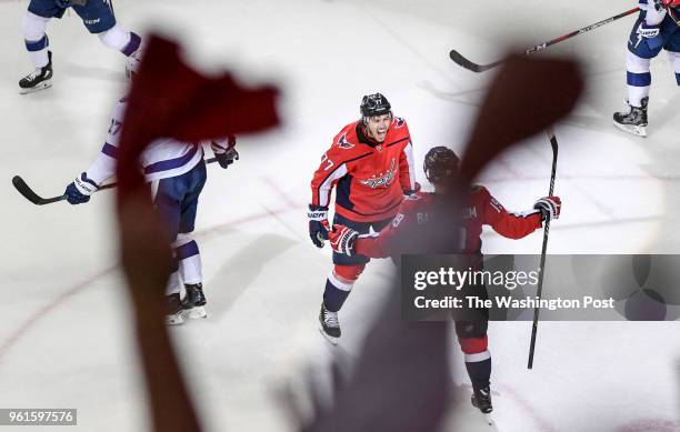 Fans wave their towels after Washington Capitals right wing T.J. Oshie scored in the second period against the Tampa Bay Lightning during game six of...