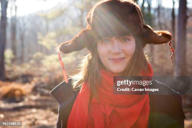 portrait of woman in hunters cap at forest - hunters cap stockfoto's en -beelden