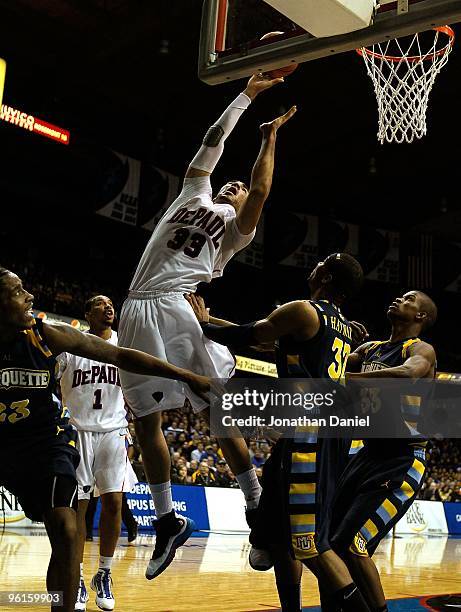 Krys Faber of the DePaul Blue Demons attempts a shot against Dwight Buycks, Lazar Hayward and Jimmy Butler of the Marquette Golden Eagles at the...