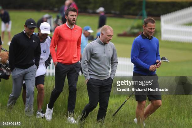 Rory Mcilroy of Northern Ireland walks with Michael Carrick, Paul Scholes and Teddy Sheringham during the Pro Am for the BMW PGA Championship at...