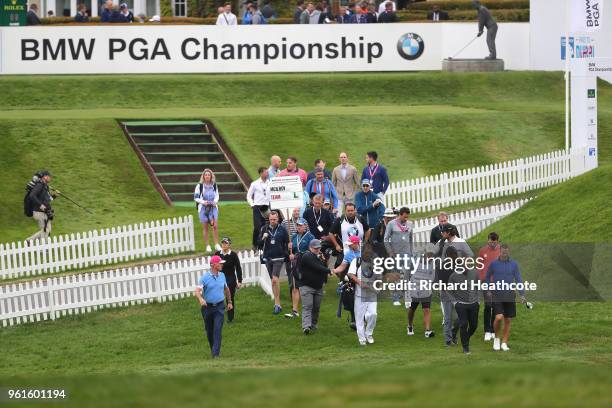 Rory Mcilroy of Northern Ireland walks with Michael Carrick, Paul Scholes and Teddy Sheringham during the Pro Am for the BMW PGA Championship at...