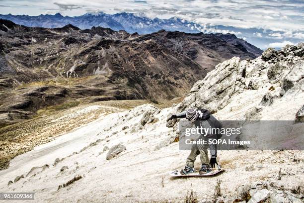 Sandboarding on the summit of Pico Pan de Azucar, the highest place to practice sandboard in the world . Sandboarding is an activity similar to...