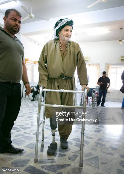 April 23: Old man with prosthesis and walker in Heevie rehabilitation center on April 23, 2018 in DOHUK, IRAQ. German goverment supports this project.