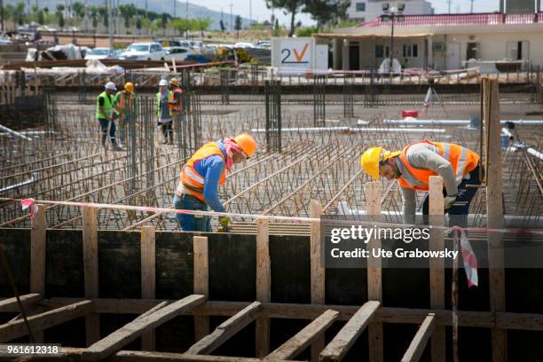 April 23: Workers at the construction site of Azadi Hospital on April 23, 2018 in DOHUK, IRAQ.