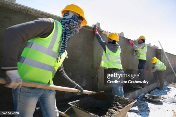 April 23: Construction workers build a wall around the refugee camp Kabarto 2 in the district Semeel on April 23, 2018 in DOHUK, IRAQ. The german...