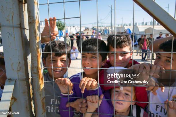 April 23: Refuge Camp Kabarto 2 in District Semeel. Children behind a lattice on April 23, 2018 in DOHUK, IRAQ.