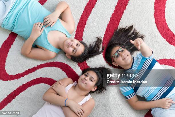 triplets teenage brothers - two young arabic children only indoor portrait stock pictures, royalty-free photos & images