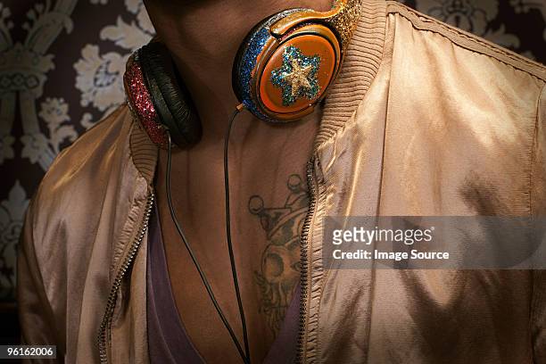 close up of man with headphones around neck - headphone man on neck stock pictures, royalty-free photos & images