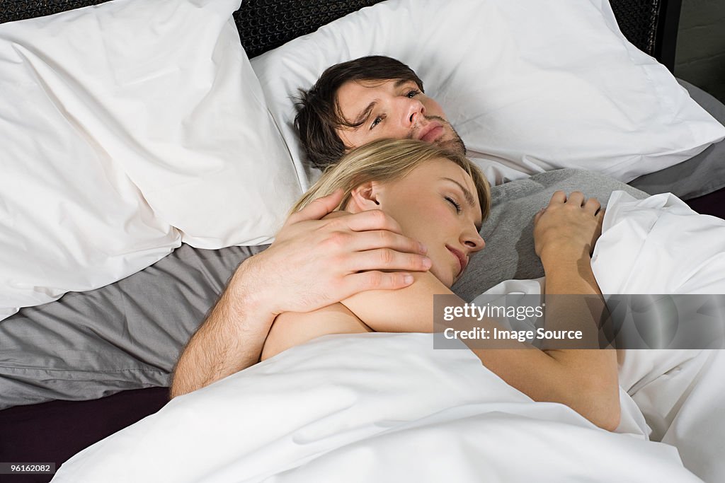 Young couple in bed