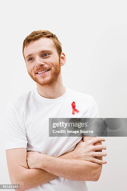 man wearing aids awareness ribbon - red beard stock pictures, royalty-free photos & images