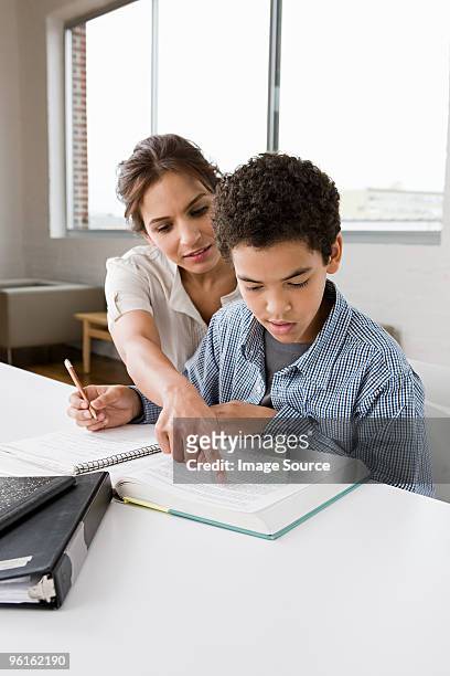 woman mentoring boy - charity education stock pictures, royalty-free photos & images