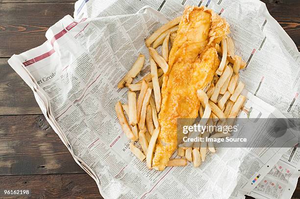 fish and chips - chips on paper stock pictures, royalty-free photos & images