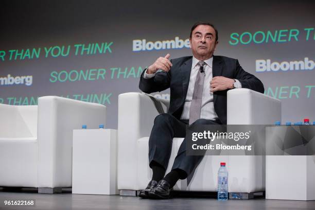 Carlos Ghosn, chairman of the alliance between Renault SA, Nissan Motor Co. And Mitsubishi Motors Corp., gestures while speaking during Bloomberg's...